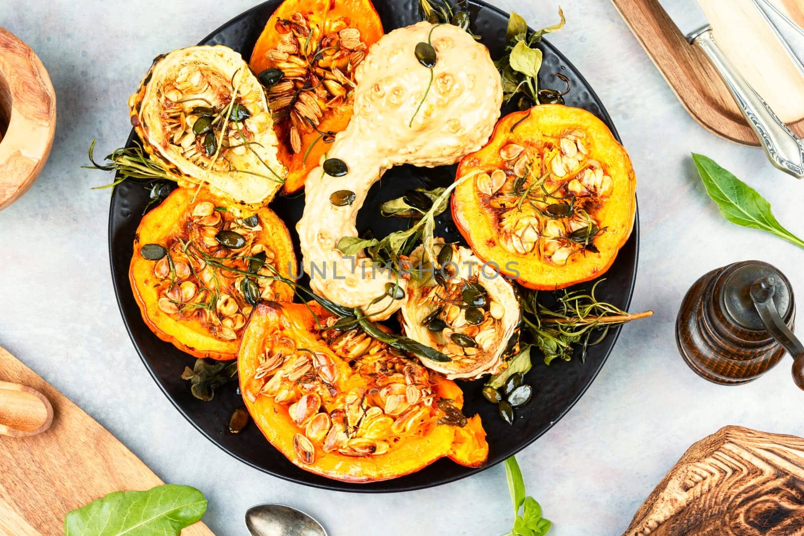 Delicious baked or butternut squash pumpkin with herbs.