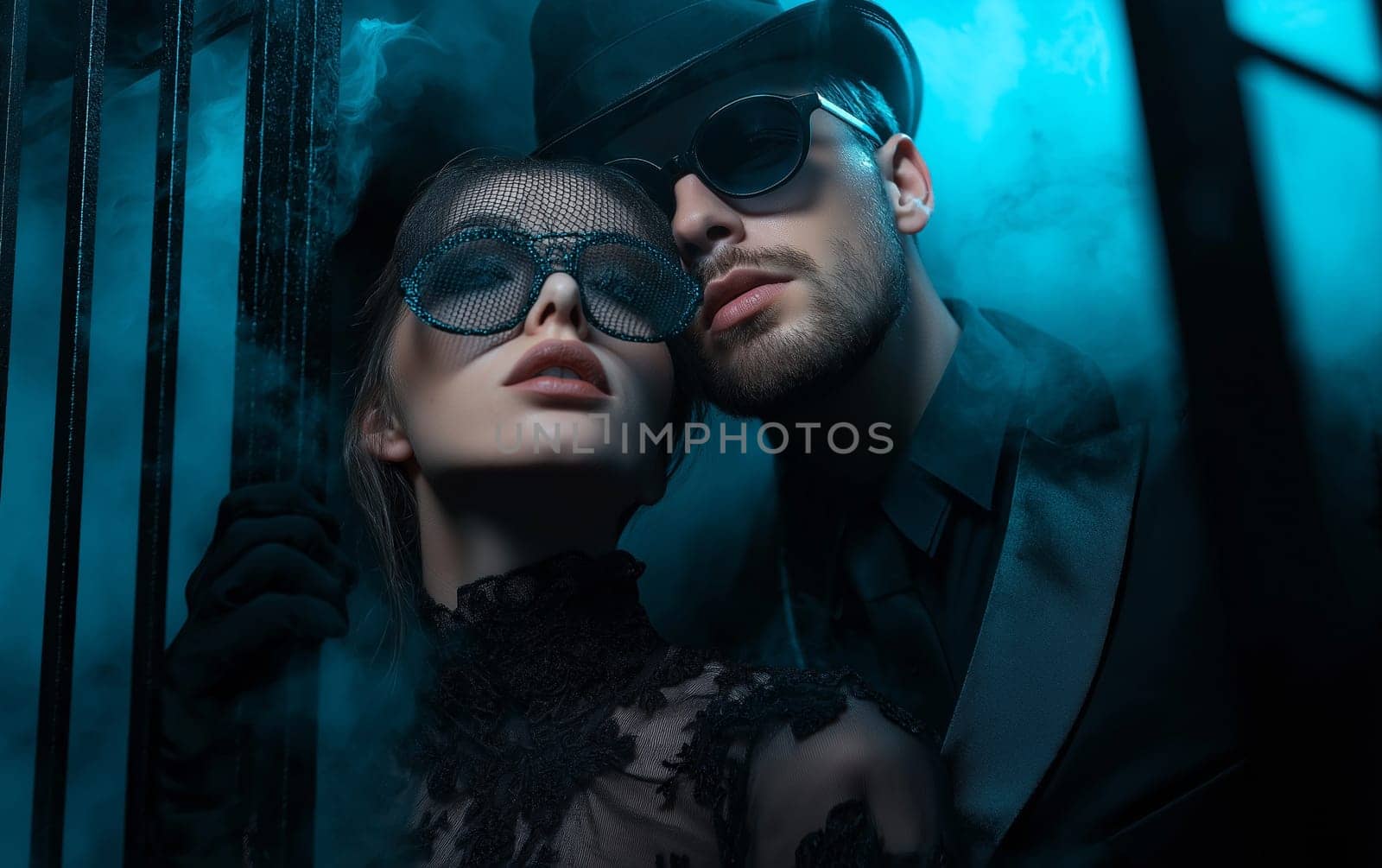 Handsome man in a hat and elegant woman in a dress in a classic interior. Halloween party carnival concept.