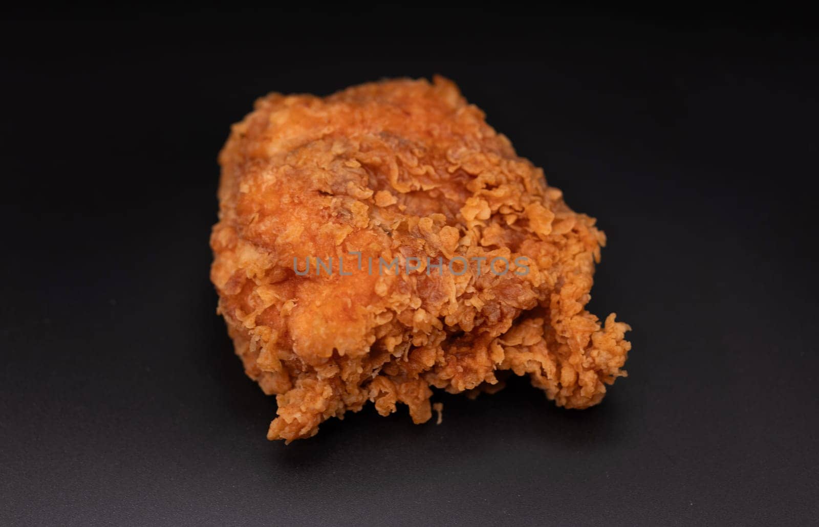 Fried chicken on black background
