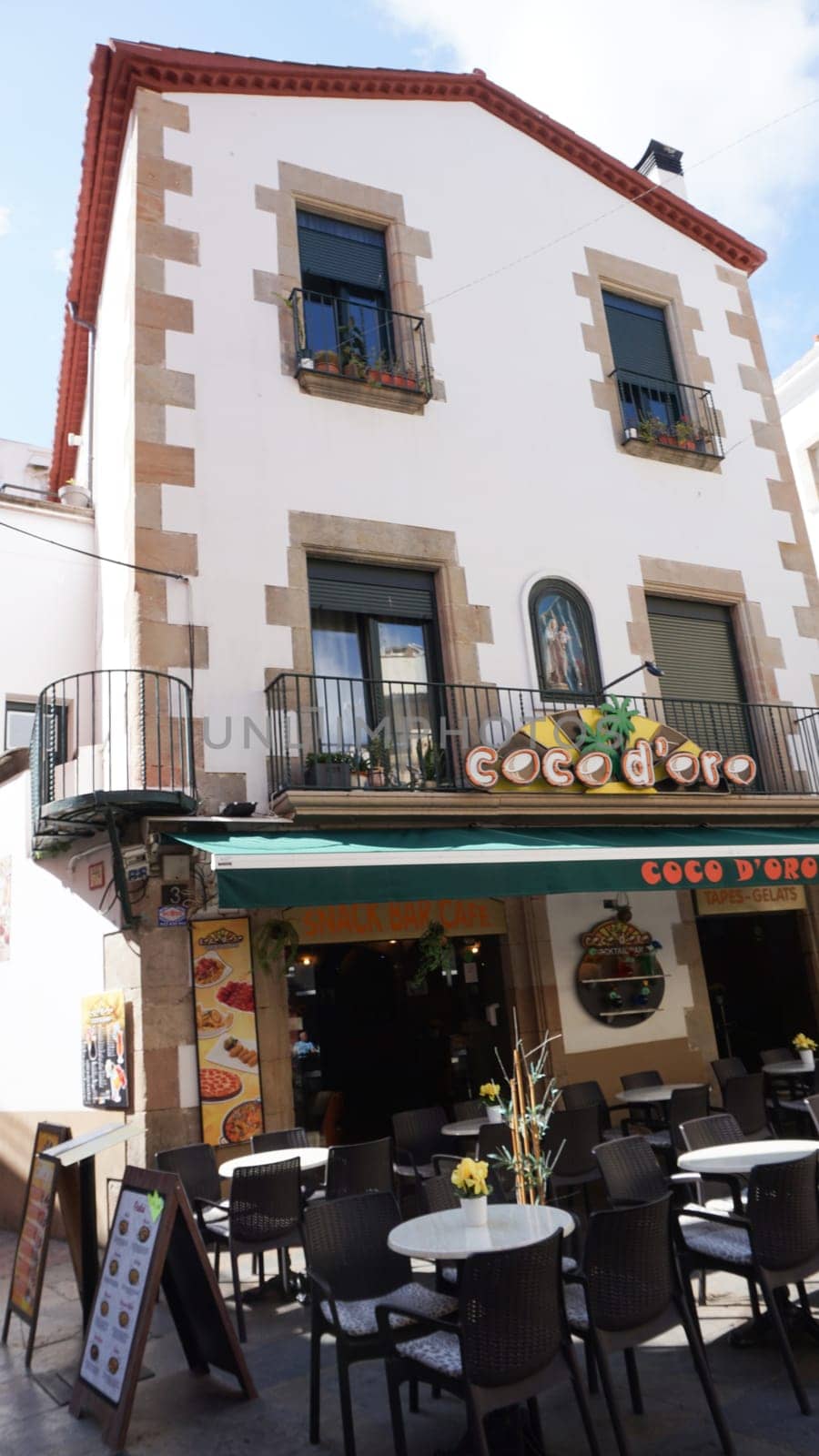 Lloret de mar, Spain - September 30, 2024: Street cafe in the city Lloret de mar on the Mediterranean coast.