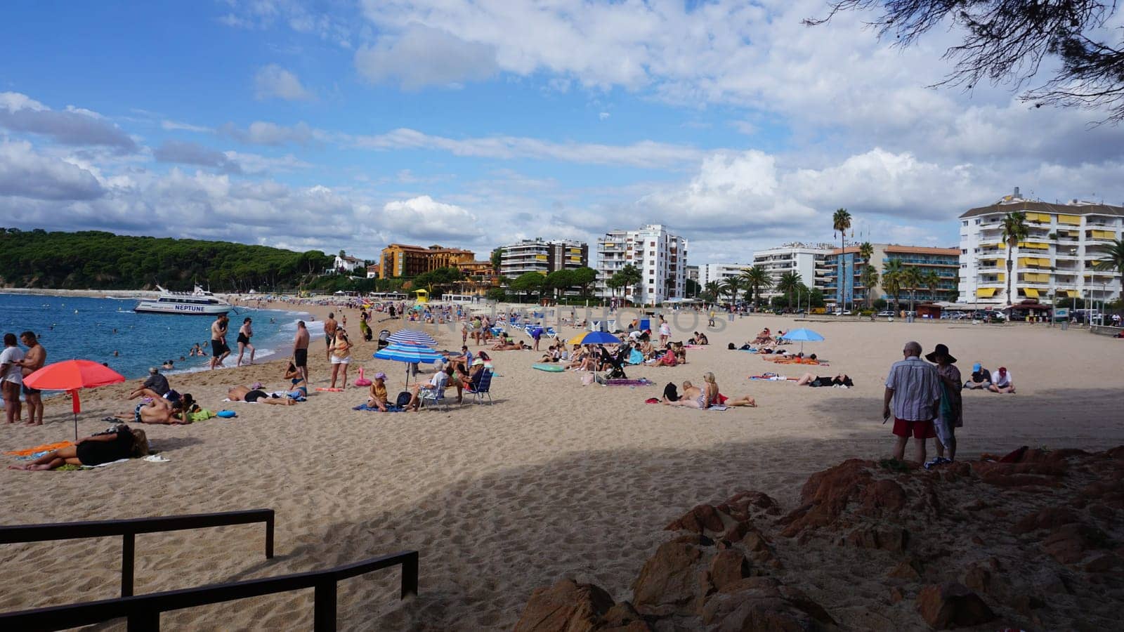 Lloret de mar, Spain - September 30, 2024: People resting at Fenals beach in Lloret de Mar in the Costa Brava, Catalonia, Spain