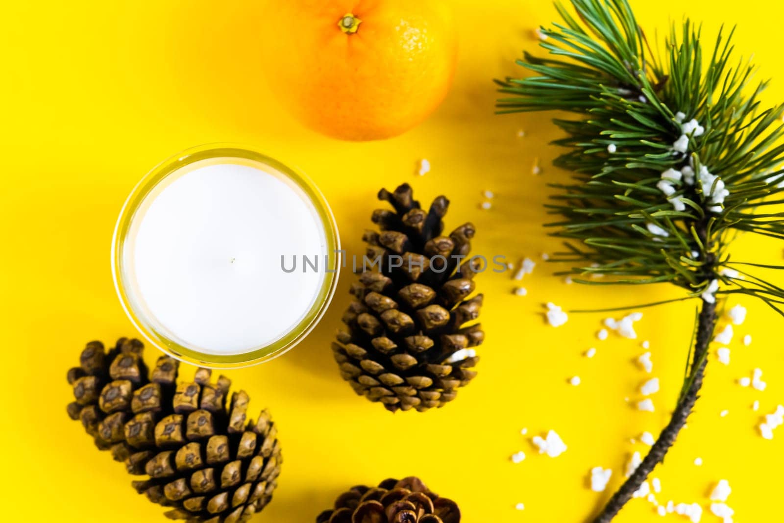 Christmas background with a fir tree branches and tangerines. Merry Christmas and Happy New Year