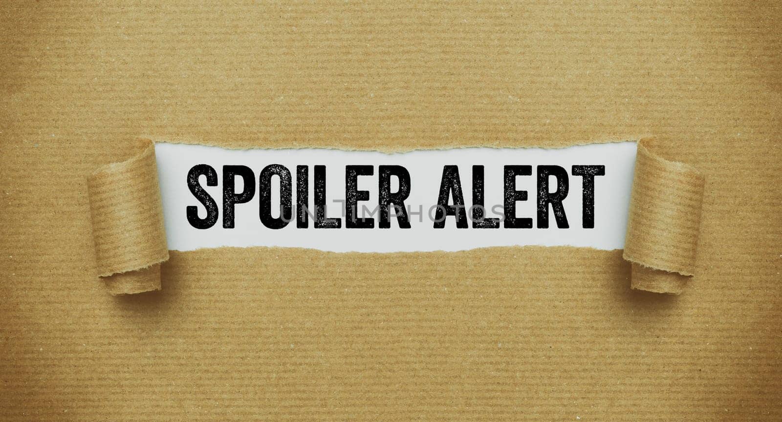 Torn paper revealing the words Spoiler alert