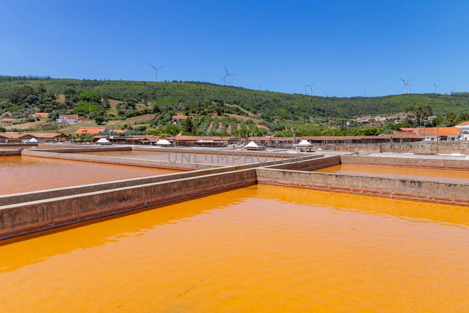 Rio Maior, Portugal: July 7, 2024: Fonte da Bica Salt Flats, aka Salinas de Rio Maior, system of shallow water compartments and gutters for salt extraction, Portugal