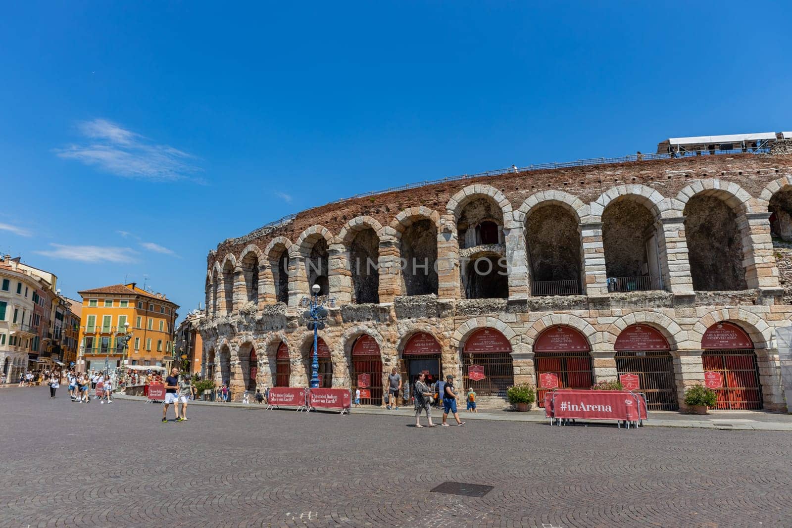 Verona, Italy: July 12, 2024: The Verona Arena in Piazza Bra square. Roman amphitheatre Arena di Verona ancient building, sunny day, historical city centre