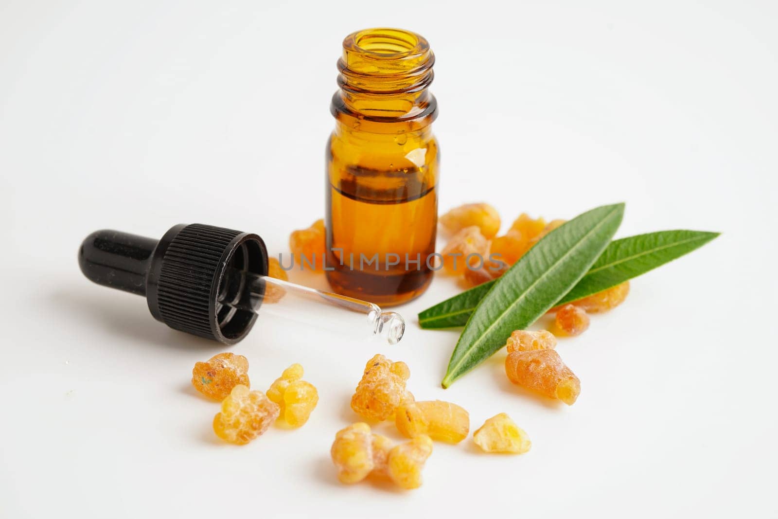 Frankincense or olibanum aromatic resin isolated on white background used in incense and perfumes.