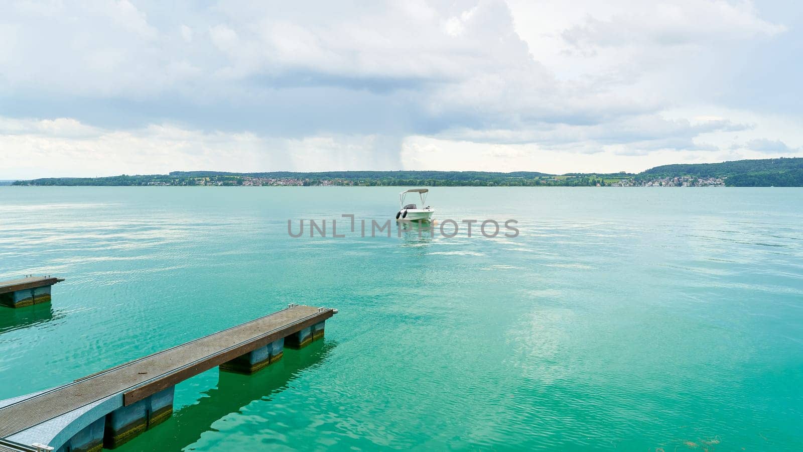 Jetty and motorboat in Ueberlingen on Lake Constance, Bodensee in Germany