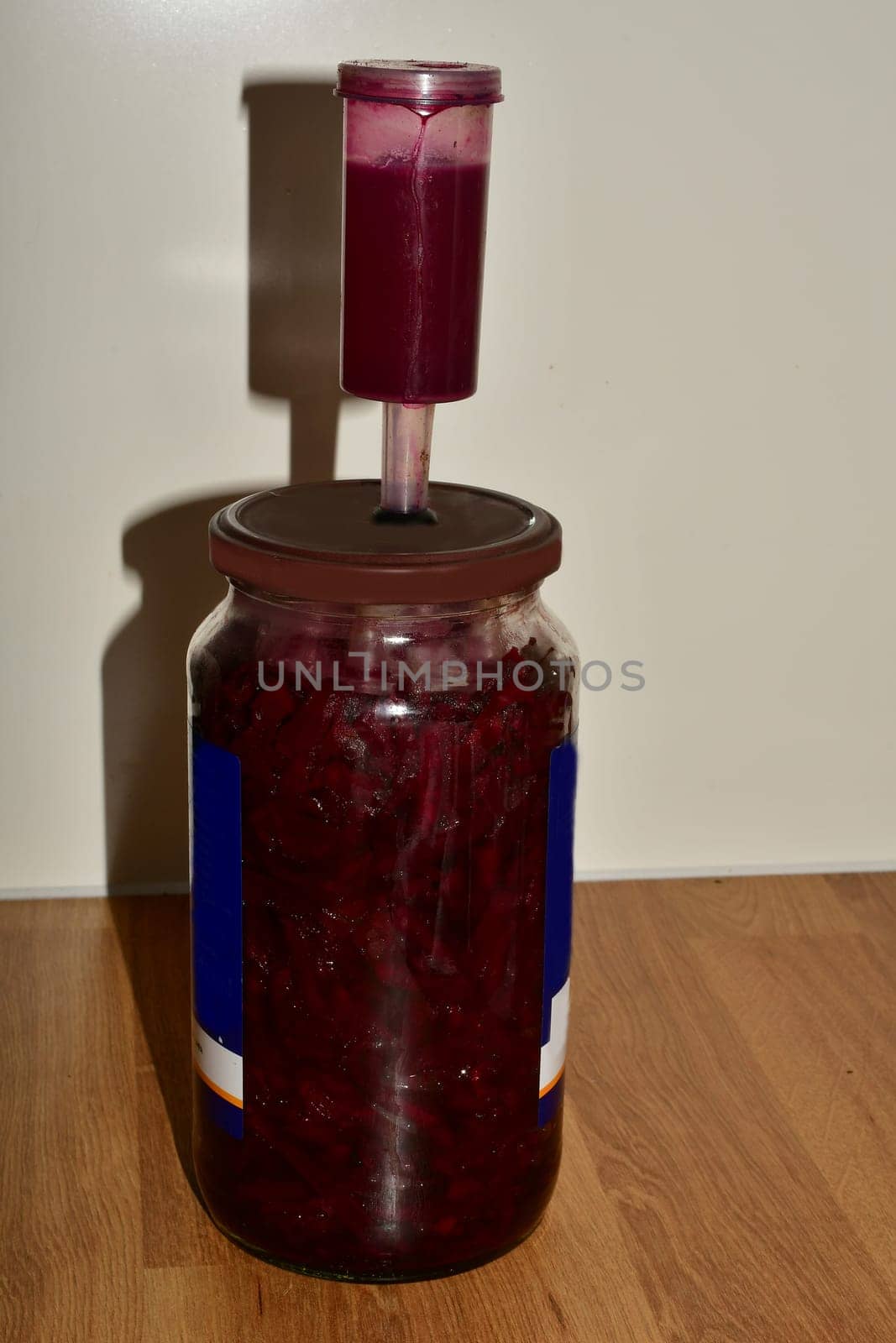 Fermentation of beetroot in a glass with fermentation valve