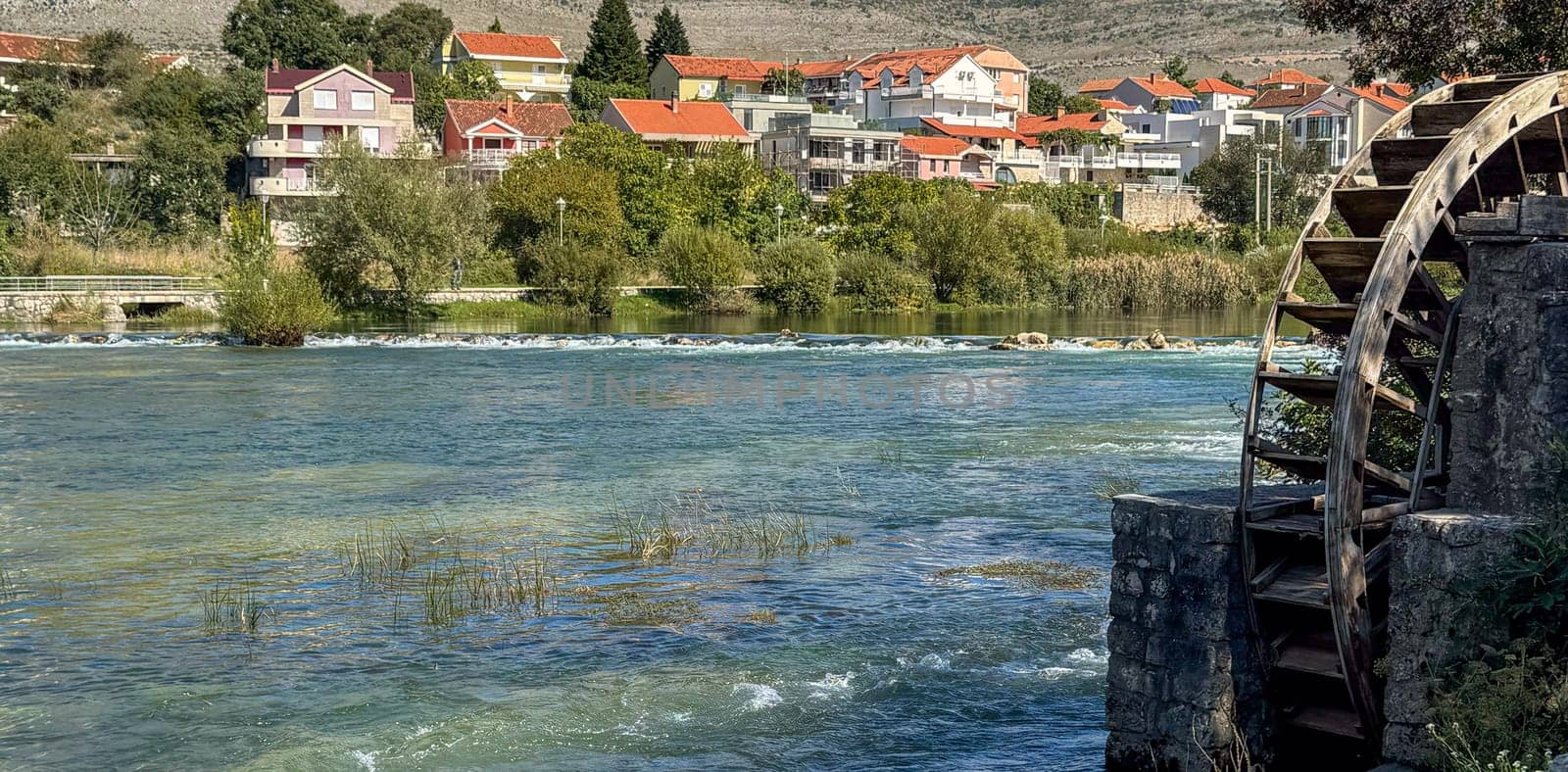 Cityscape from the Trebisnica River from an old water wheel. Trebinje, Bosnia and Herzegovina, 2 October 2024