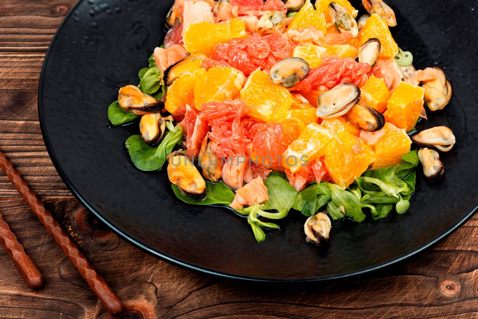 Seafood salad with fresh grapefruit, orange and mussels.