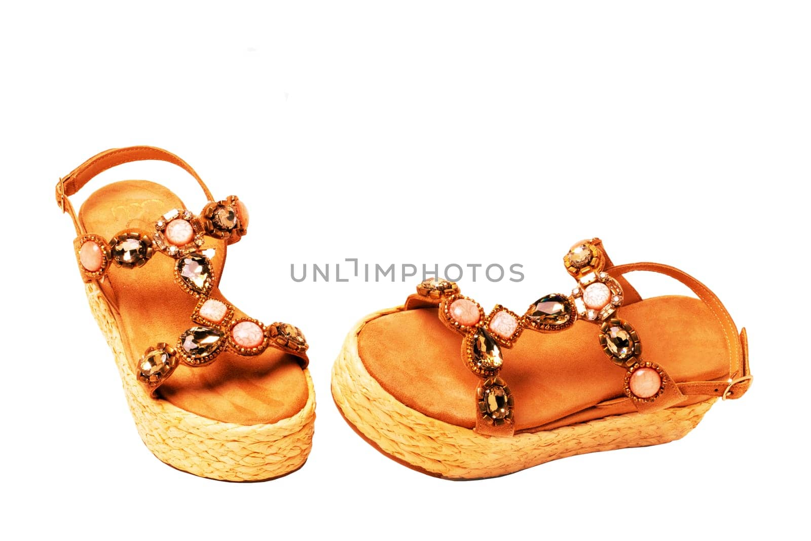 Leather shoes isolated. Close-up of a single of elegant female suede sandals with rhinestones. Isolated on white background. Macro.