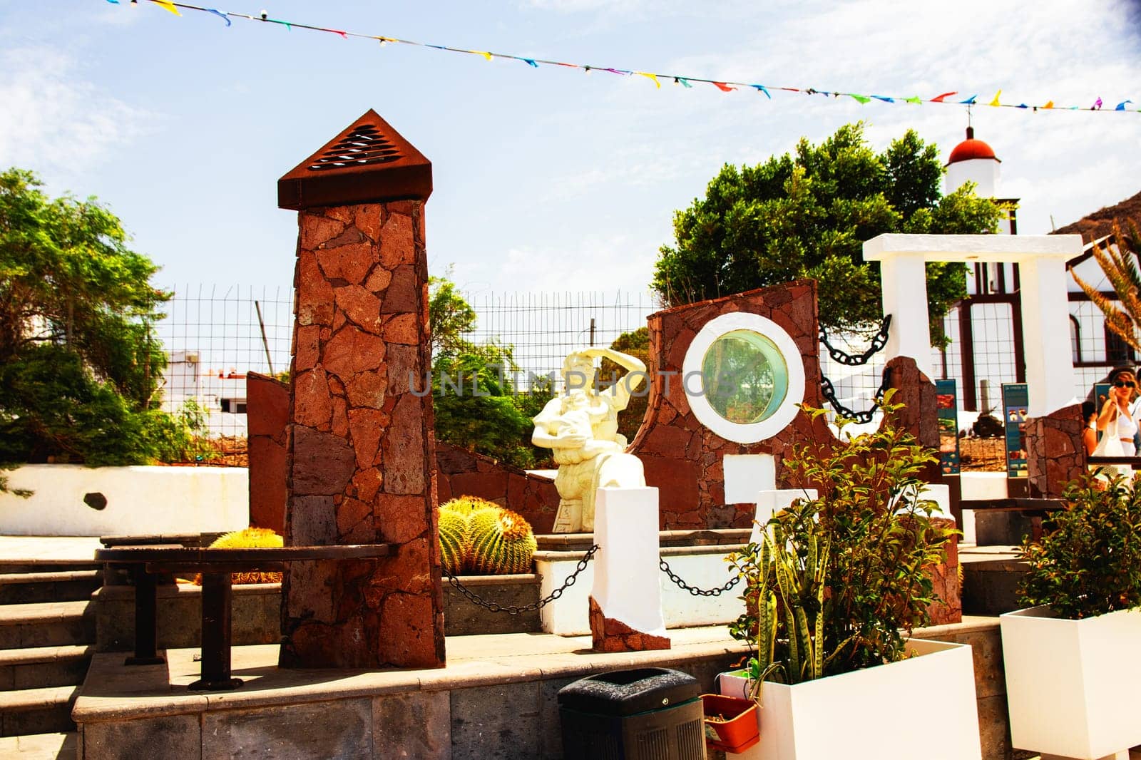 Puerto de las Nieves, Gran Canaria, Spain - 20 July 2024. Agaete was a fishing village and sculpture shows women and children waiting for the return of the fishermen.