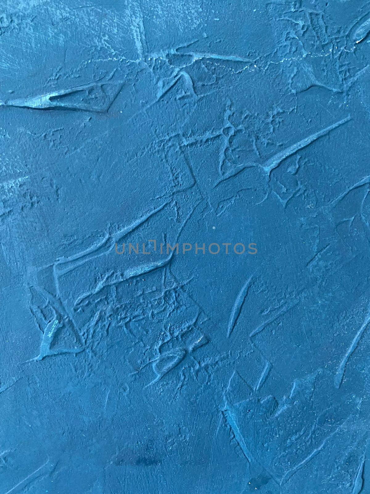 Textured deep blue panel rich color and intricate surface patterns background.