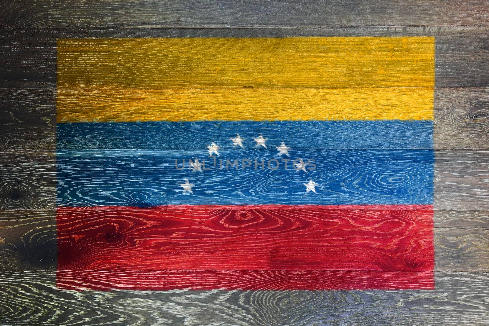 A Venezuela flag on rustic old wood surface background