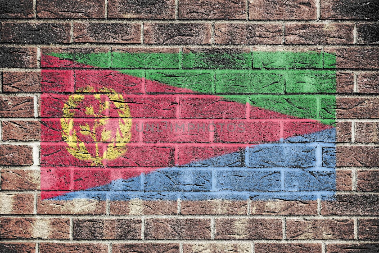 An Eritrea flag painted on brick wall background