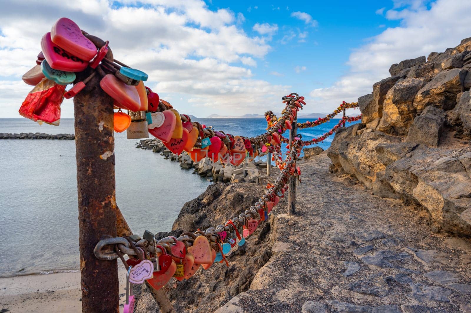 Many red heart-shaped love locks on the Playa Blanca on Lanzarote at the Playa Flamingo beach