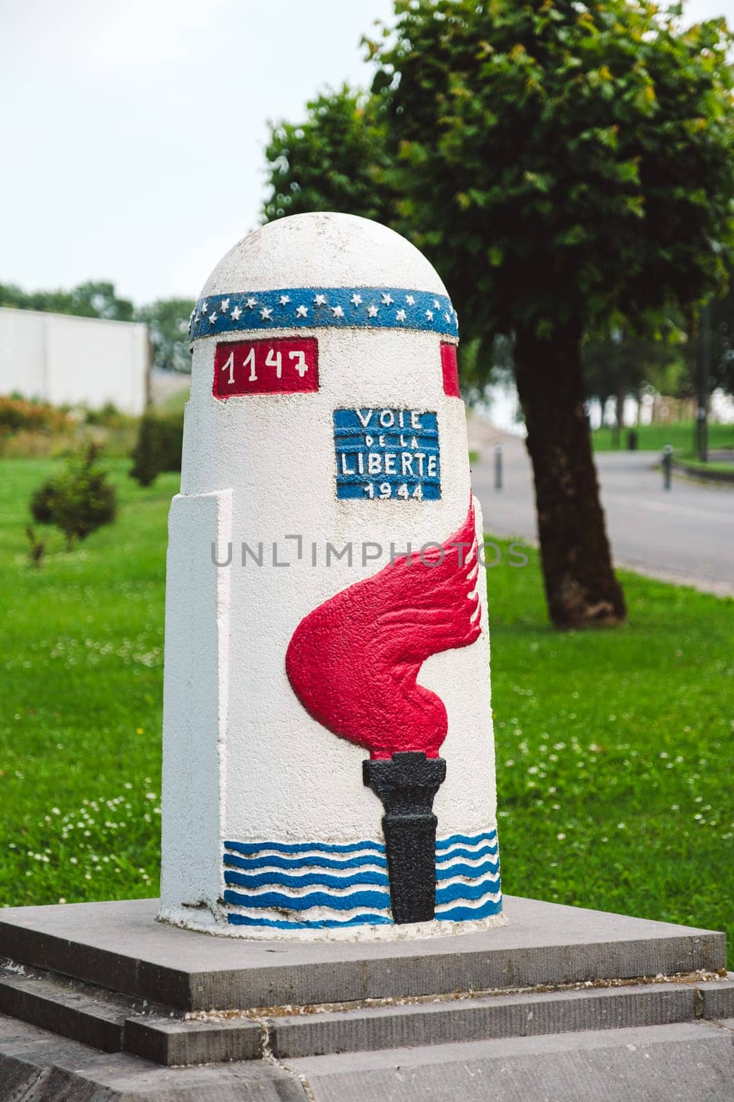Bastogne, Belgium - July 17 2021: Last Milestone (1147) of the Voie de la Liberte 1944 (Liberty Road) near Mardasson Memorial.