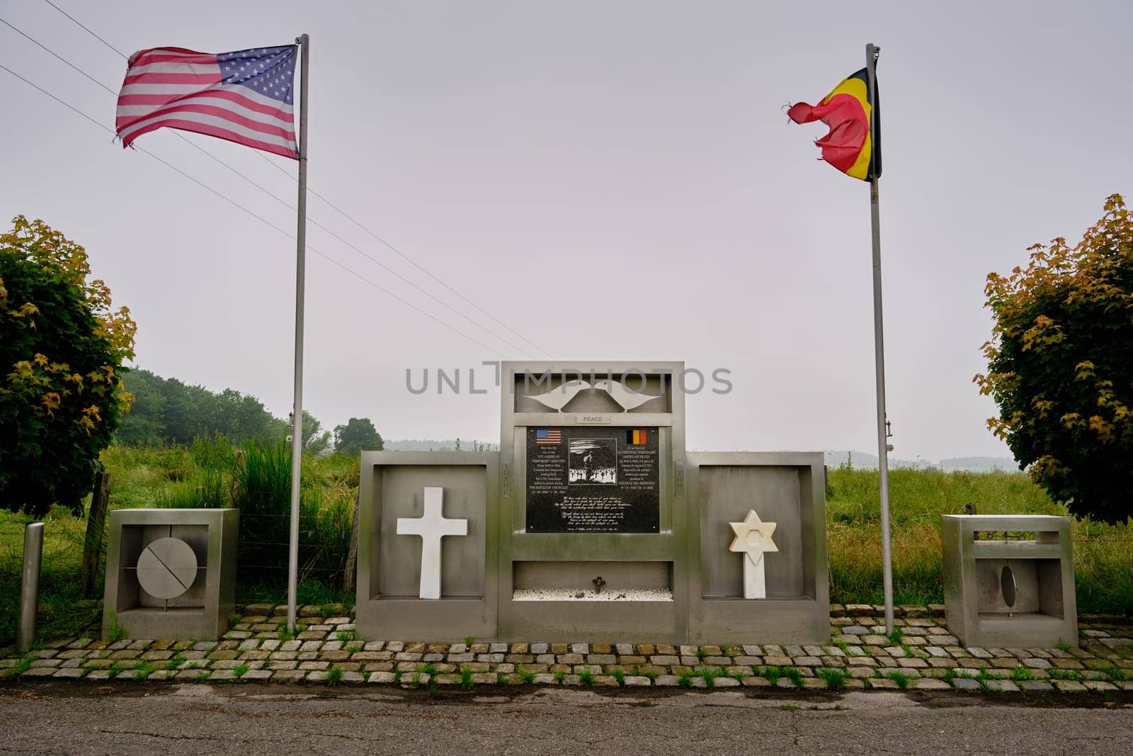 Foy, Luxembourg, Belgium - JULY 17, 2021: Memorial former American Cemetery between belgian and american flag