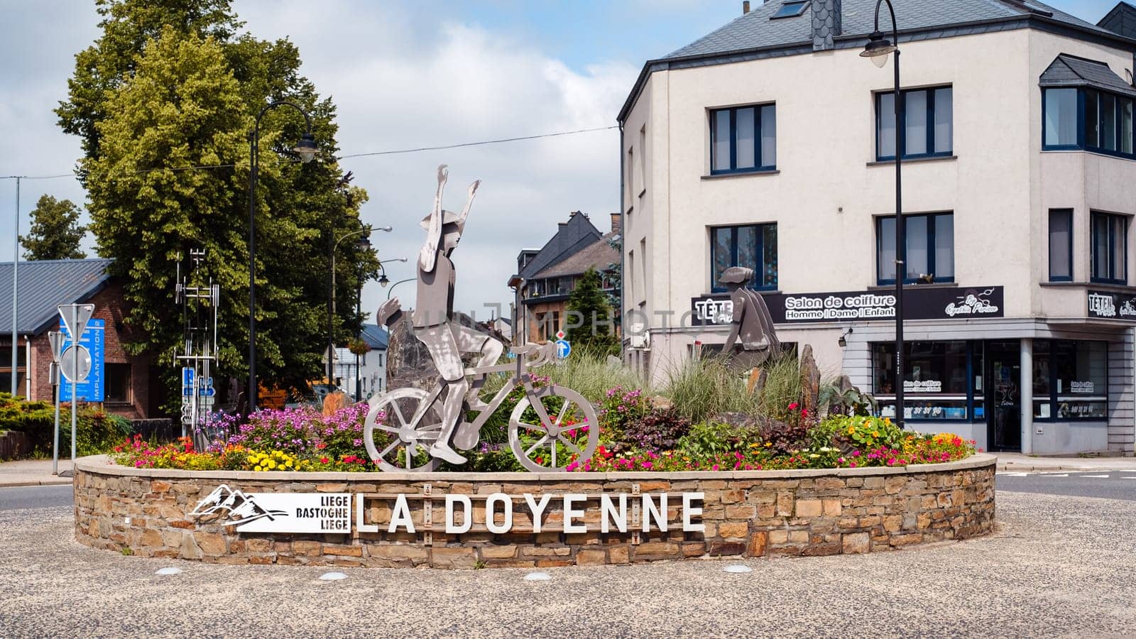 Bastogne, Belgium - July 17 2021: Statue for the Liege Bastogne Liege pro cycling race roundabout turning point in Bastogne. The race is called "La Doyenne"" (French for ""The old lady"") because it's the oldest of the 5 monuments."