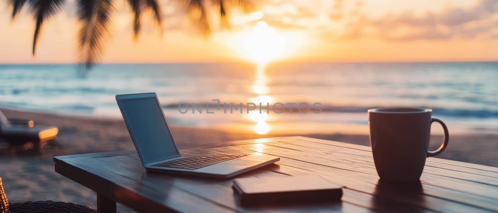 Laptop and coffee mug on wooden table overlooking serene beach at sunset, embodying remote work and digital nomad lifestyle.
