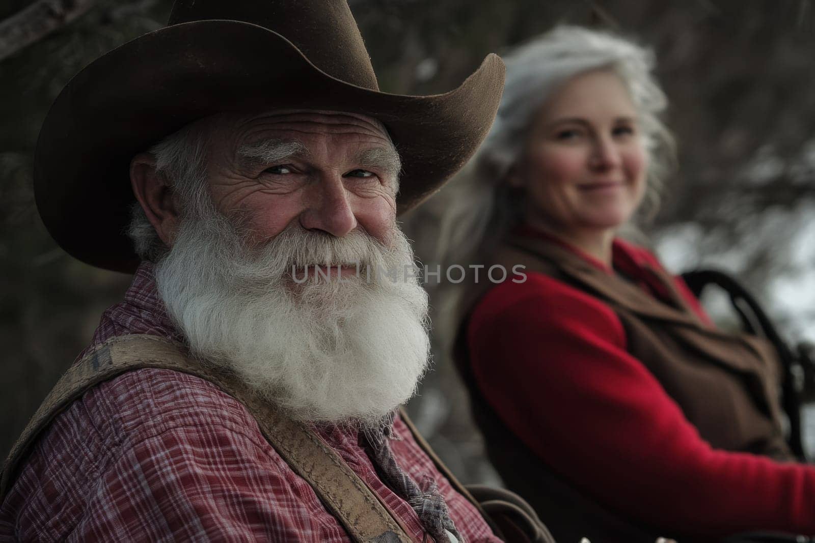 A smiling elderly couple relaxes outdoors showcasing their joyful connection amid a serene natural backdrop.