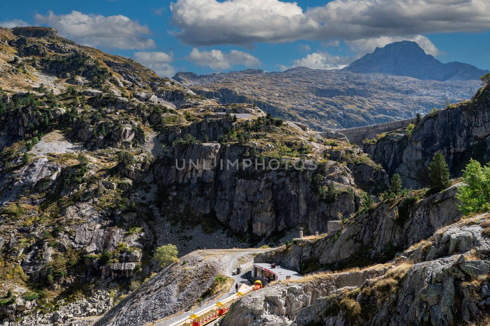 A mountain range with a railway that goes through it. It's the Artouste small railway ,Pyrenees Atlantiques, france