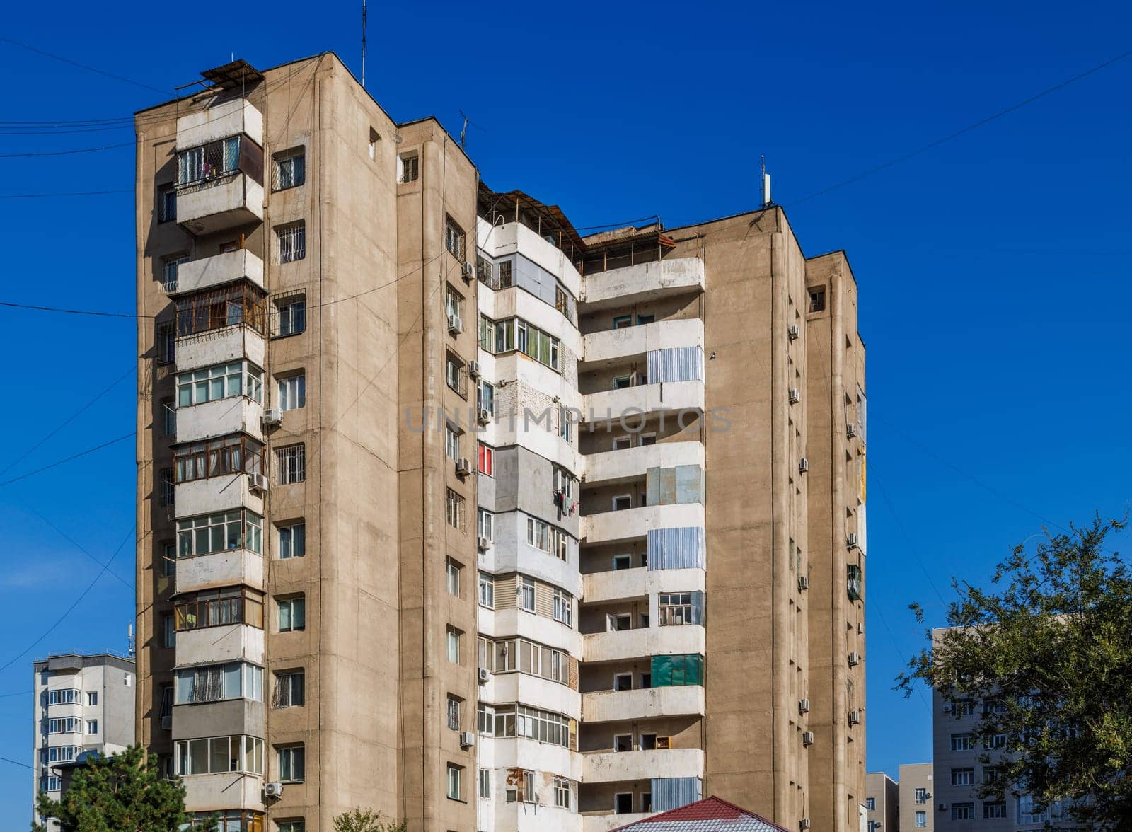 poor multistory apartment building at sunny day in Bishkek, Kyrgyzstan