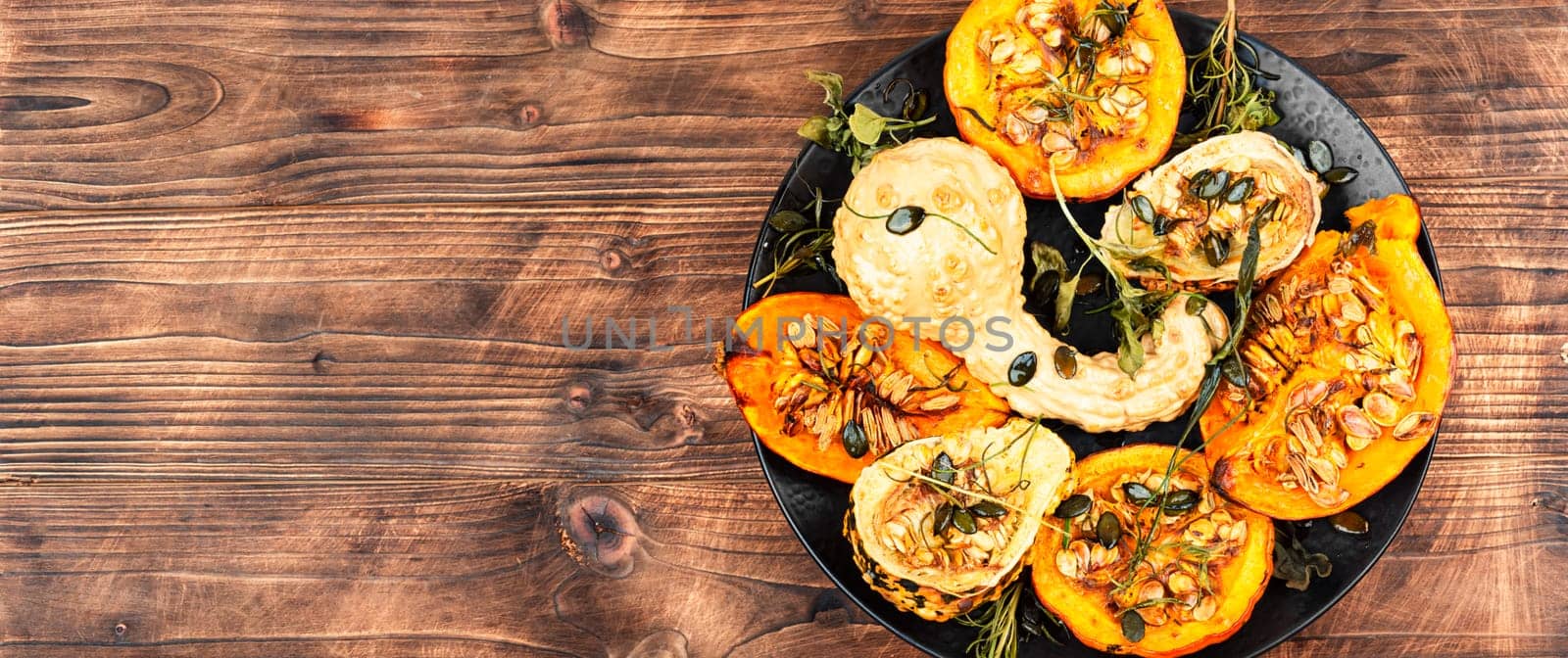 Delicious baked or butternut squash pumpkin with herbs.
