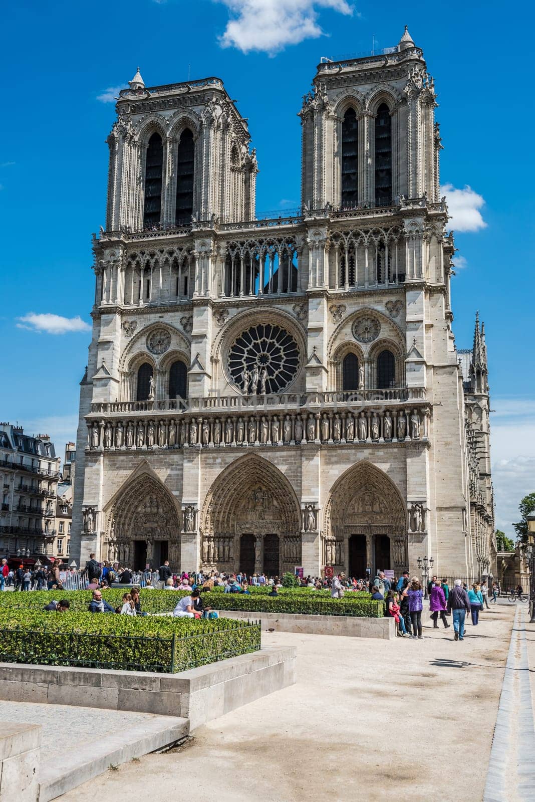 FRANCE, PARIS - JUNE 01: Tourists enjoy sightseeing near the Cathedral of Notre Dame in Paris on June 01, 2015