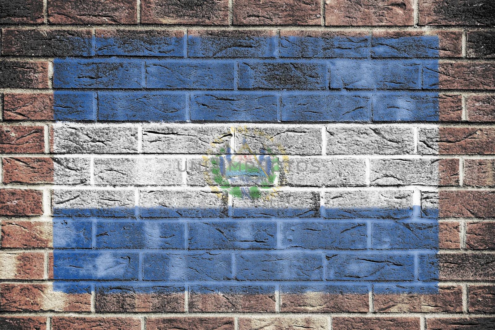 An El Salvador flag painted on brick wall background