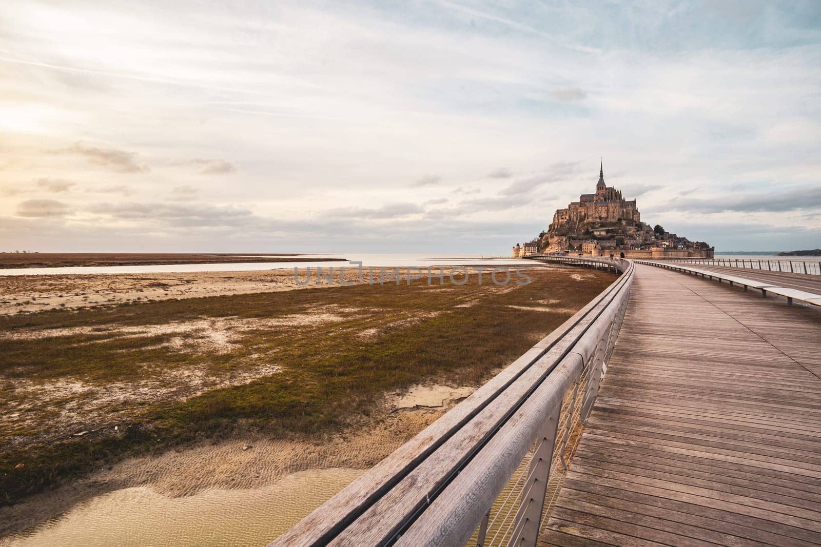 Le Mont-saint-michel photographed in winter from his long bridge in Normandy, France