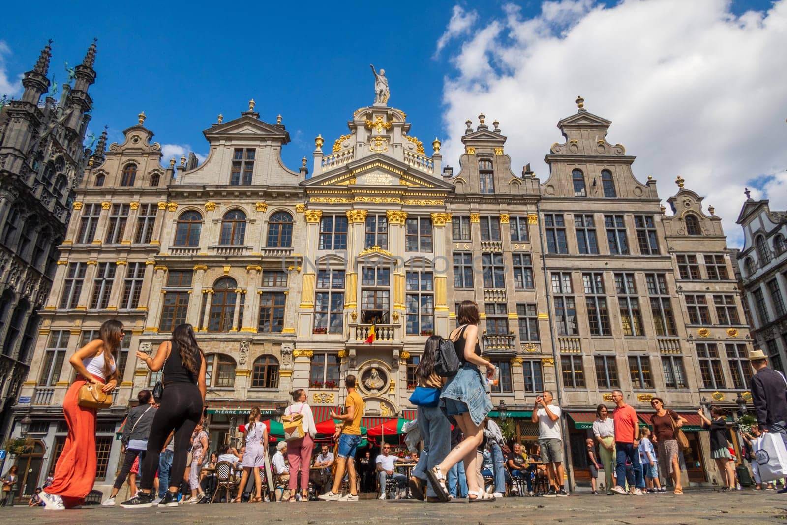 Brussels, Belgium - August 20 2022: tourists on the Grand-Place of Brussels. Photography taken in Belgium