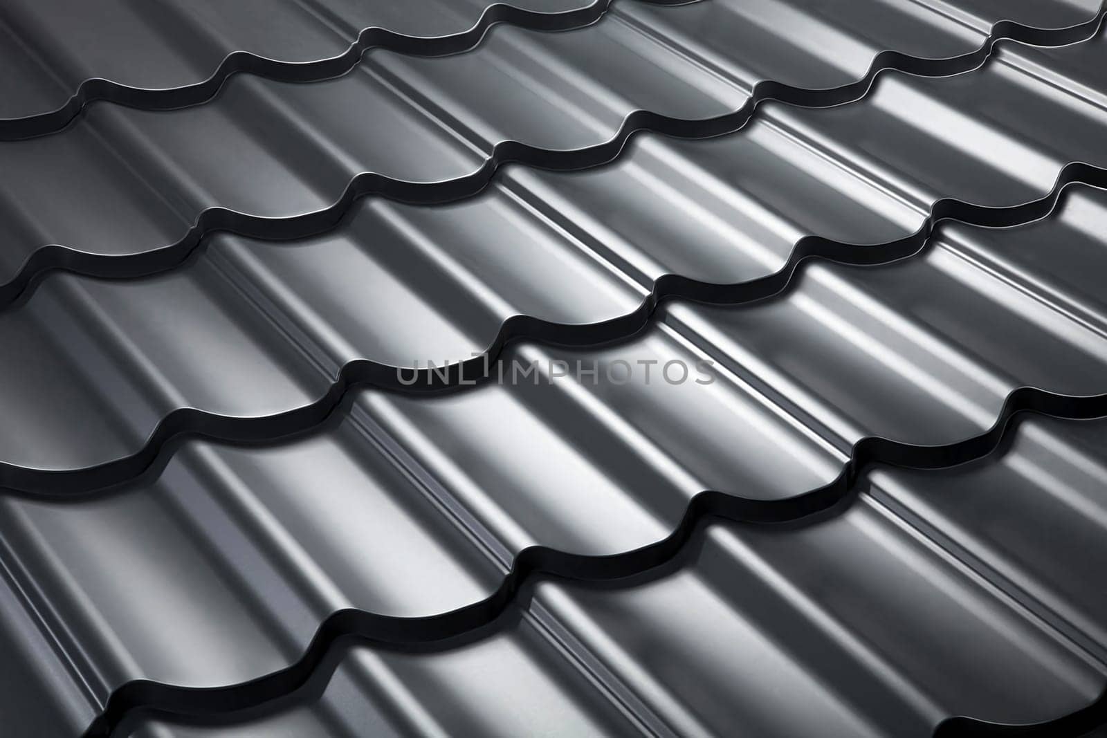 Close-up view modular tile effect roof panel. Lightweight galvanised steel roofing sheet. Traditional metal shingle tiles. Popular profiled metallic pantile mimic clay or concrete slate