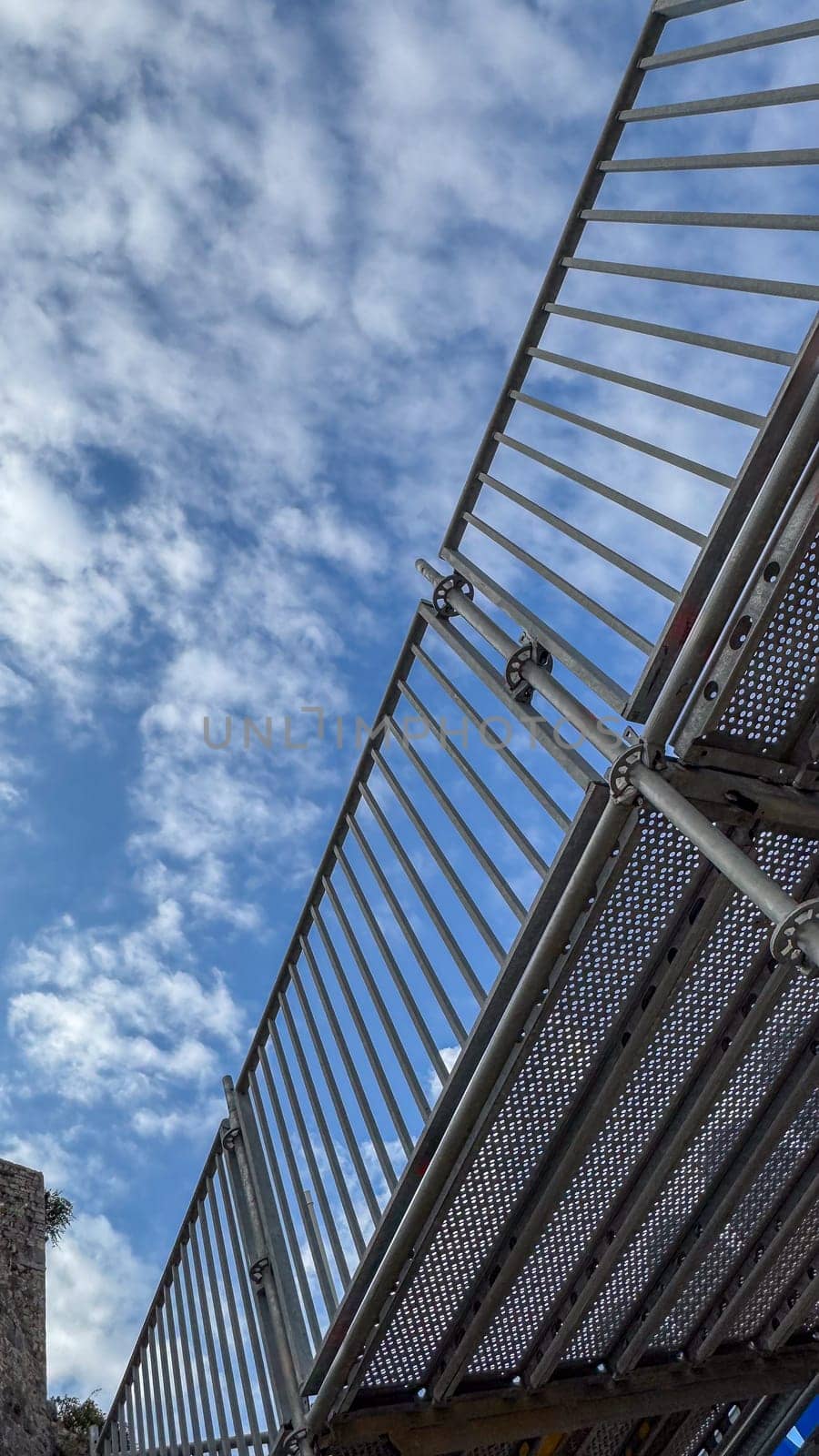 Metal Staircase Railing with Cloudy Sky Backdrop. High quality photo