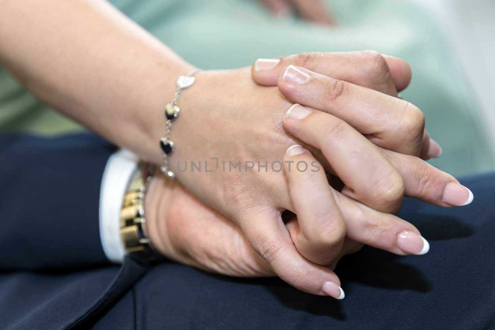 Coupled hands of a bride and groom with wedding rings. Happy day. Wedding theme.