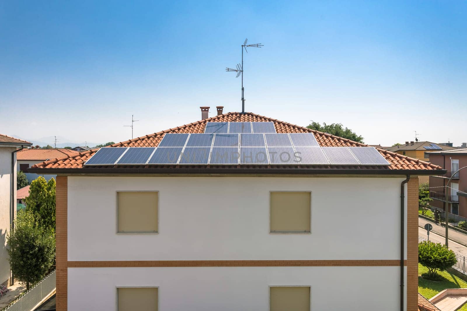 Renewable energy house with solar and thermal photovoltaic panels on roof