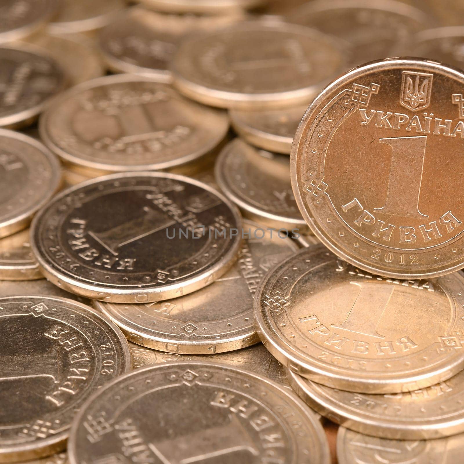 Large pile of big golden coins. Financial success money background for rich life concepts, banking and profit in Ukraine
