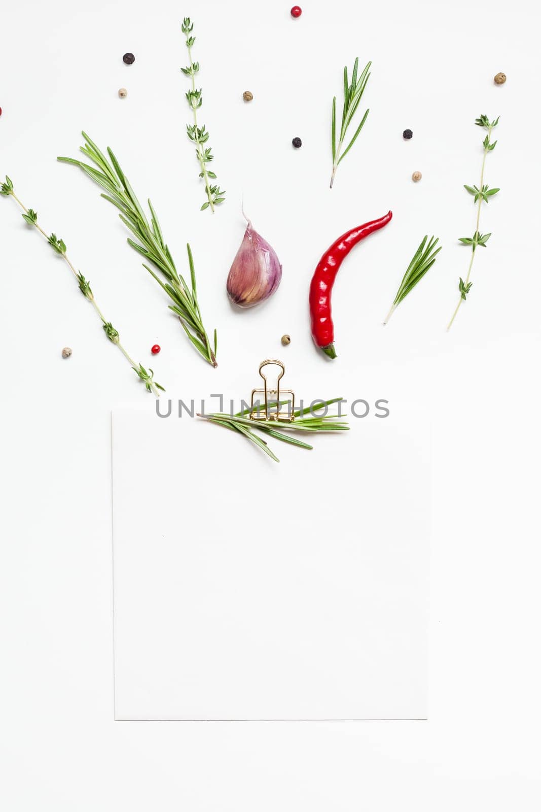 Flat lay overhead view blank notebook pages mockup text space invitation card on white background with greens herbs and spices. Menu or recipe book or food blog design with cooking ingredients