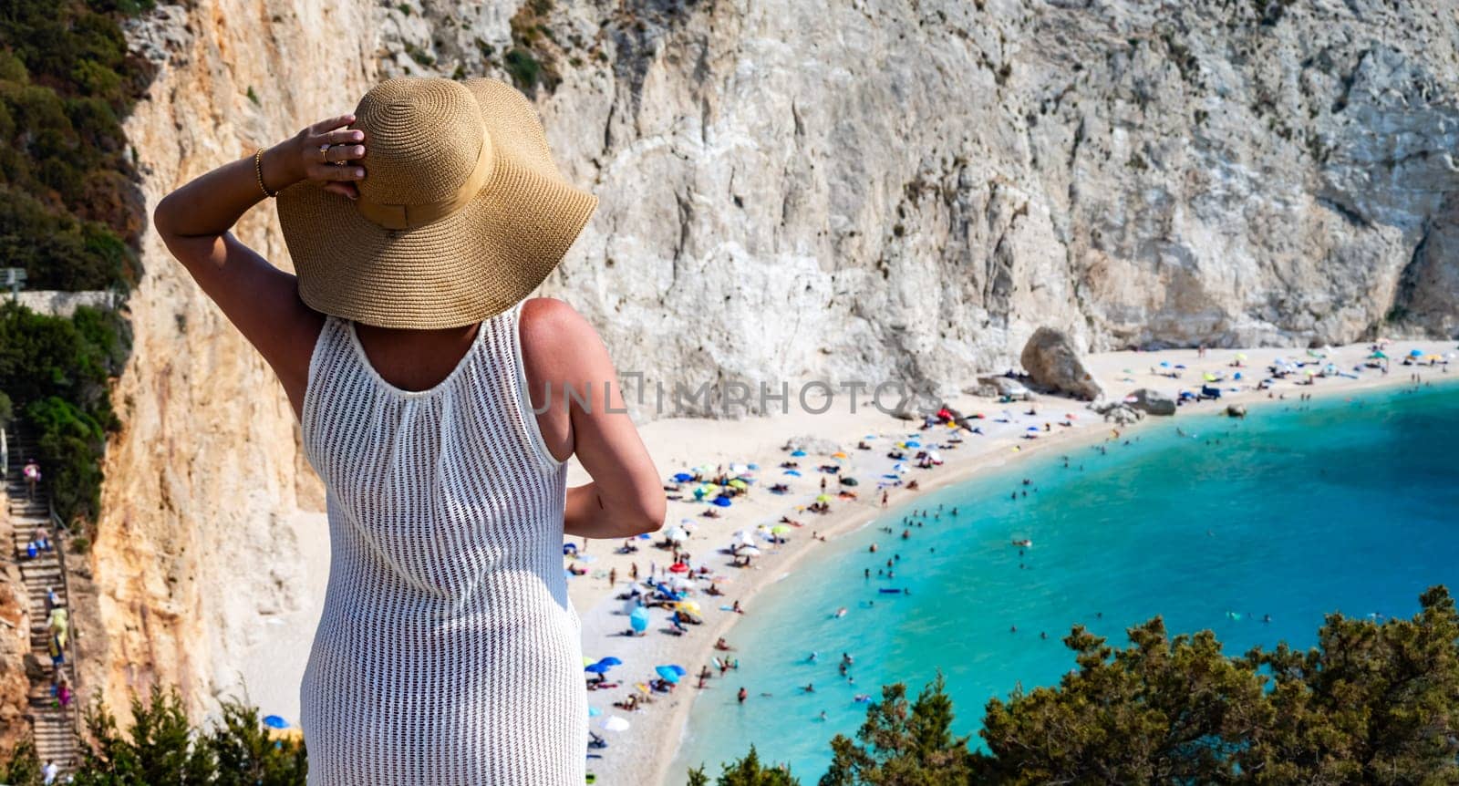 A tourist looking at Porto Katsiki Beach, on the coast of Lefkada, in the Ionian Islands of Greece