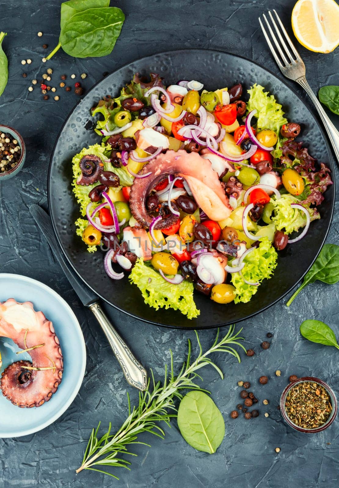 Fresh and healthy octopus salad with potatoes. Traditional Italian food. Top view.