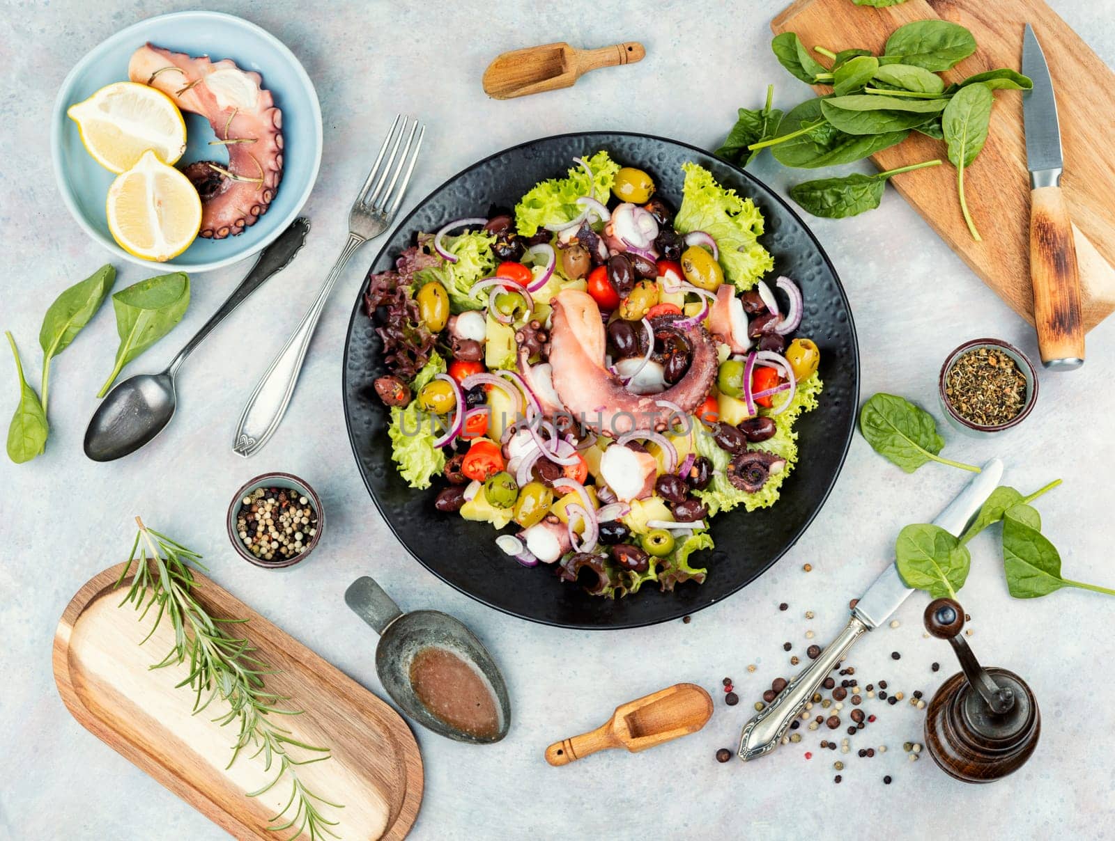 Fresh and healthy octopus salad with potatoes. Traditional Italian food. Top view.