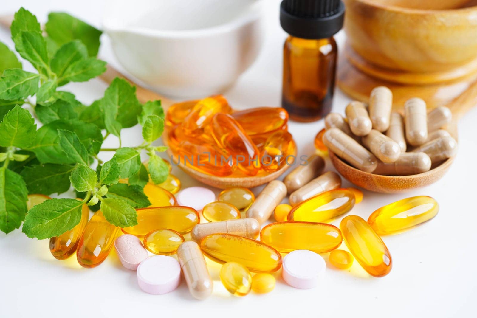 Alternative medicine herbal organic capsule with vitamin E omega 3 fish oil, mineral, drug with herbs leaf natural supplements for healthy good life.
