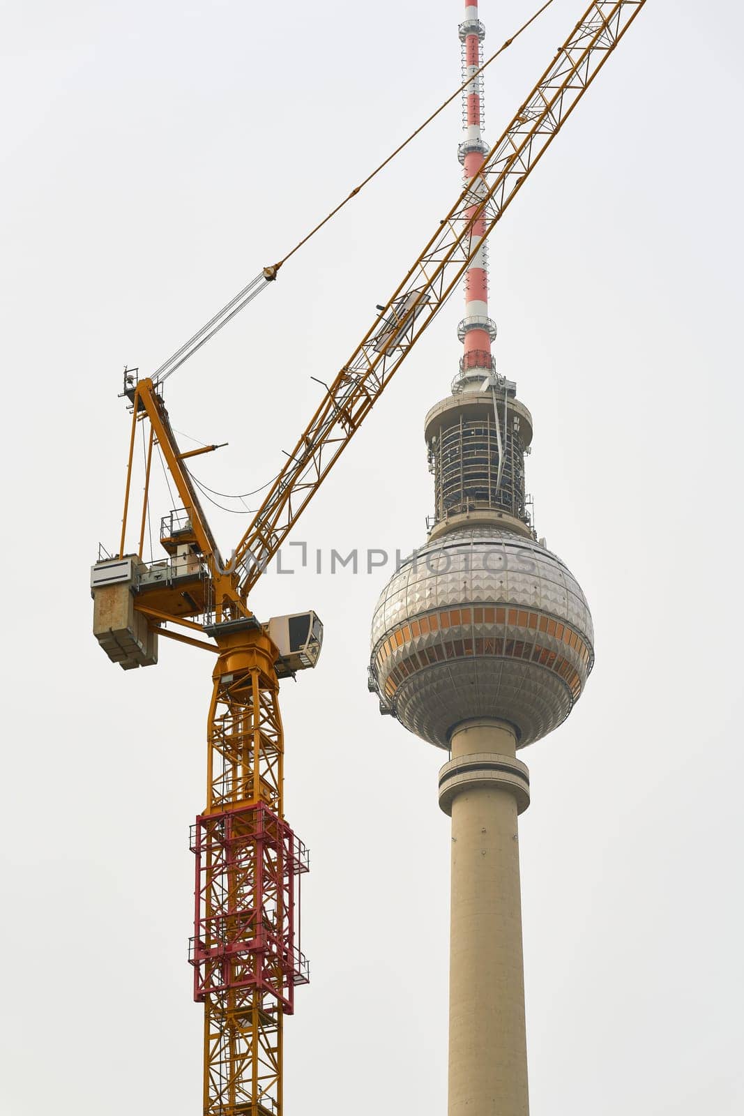 Construction crane on the Berlin television tower, the landmark of the German capital