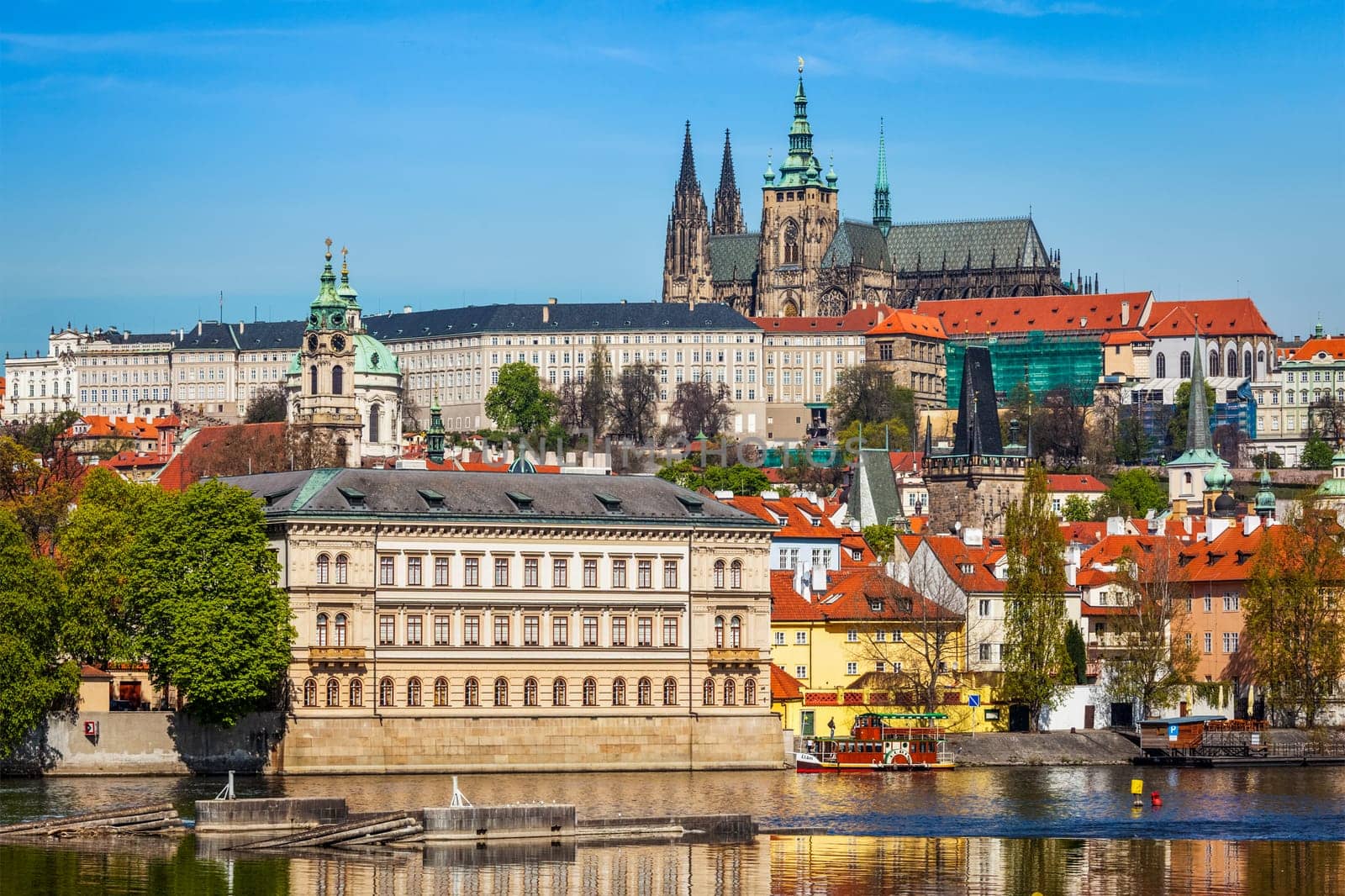 View of Charles bridge over Vltava river and Gradchany Prague Castle and St. Vitus Cathedral