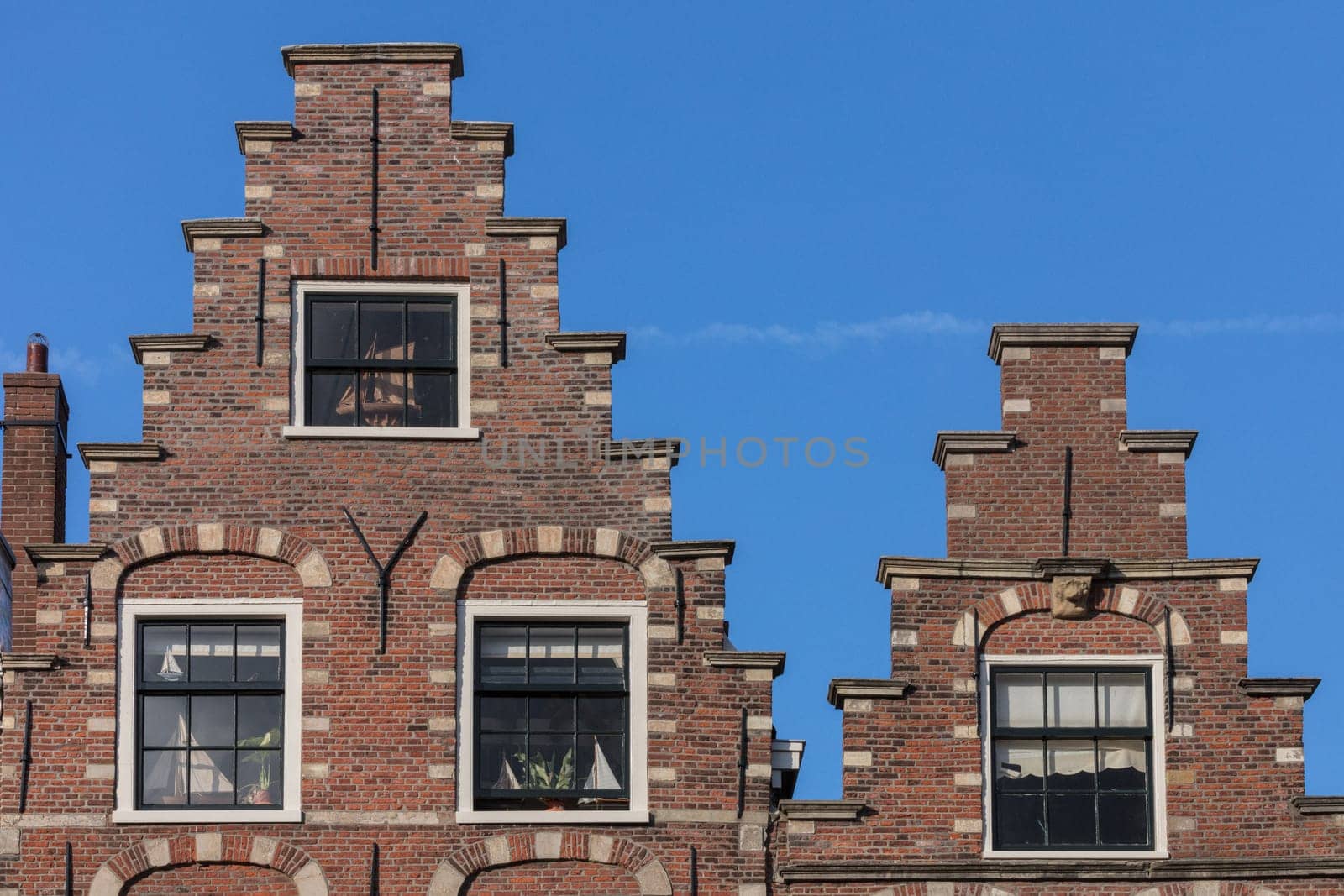 Typical Amsterdam houses over the blue sky