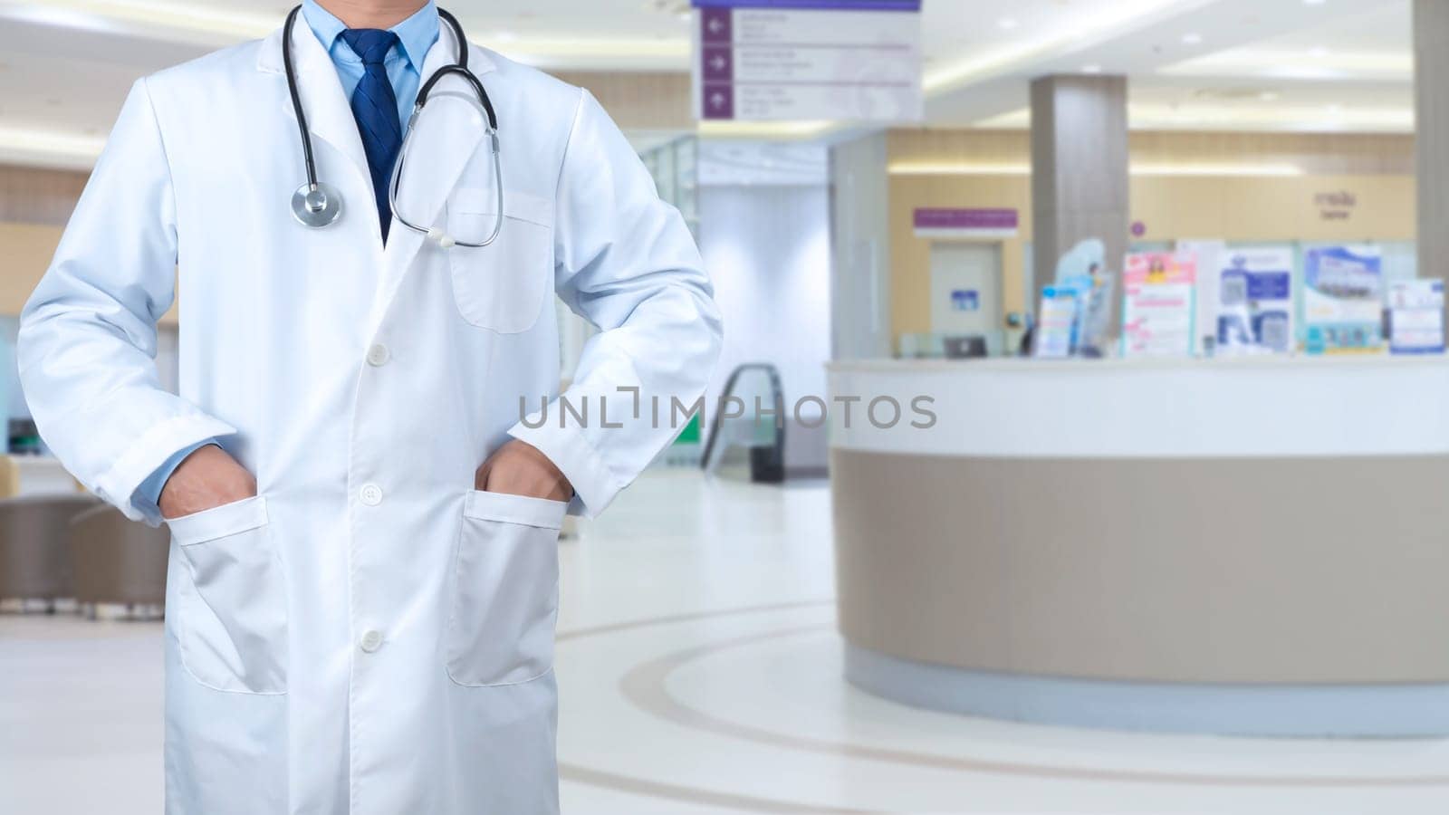 Smart doctor with a stethoscope around his neck on the hospital blurred background, Healthcare medical technology concept, copy space, Color effect tone, Copy space for text.