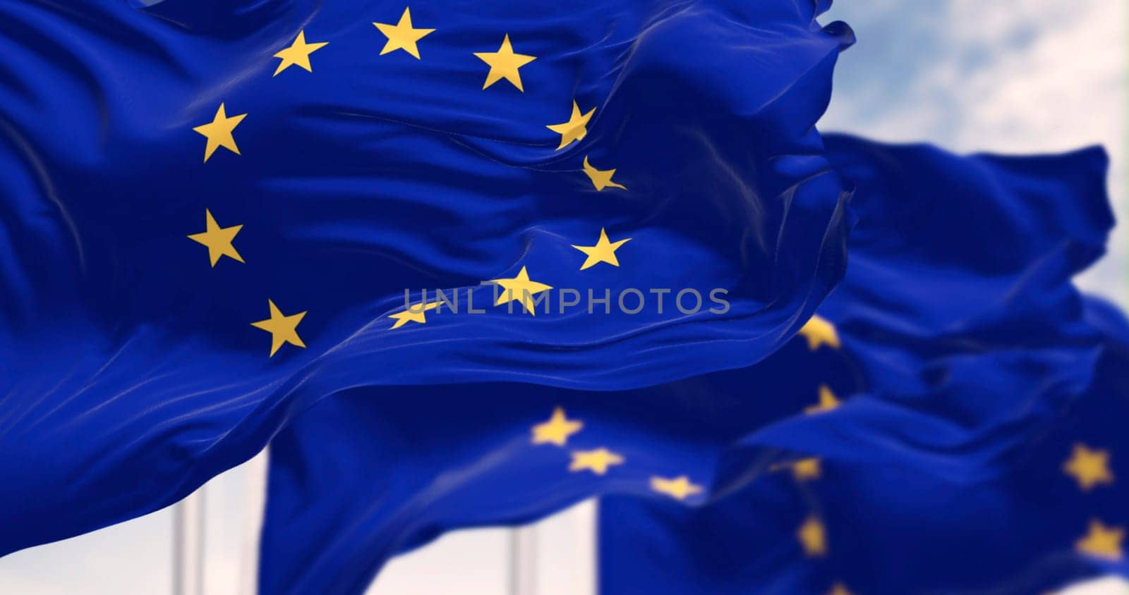 European Union flags waving in the wind on a clear day. The flags symbolize unity and cooperation among the EU member states. 3d illustration render. Selective focus