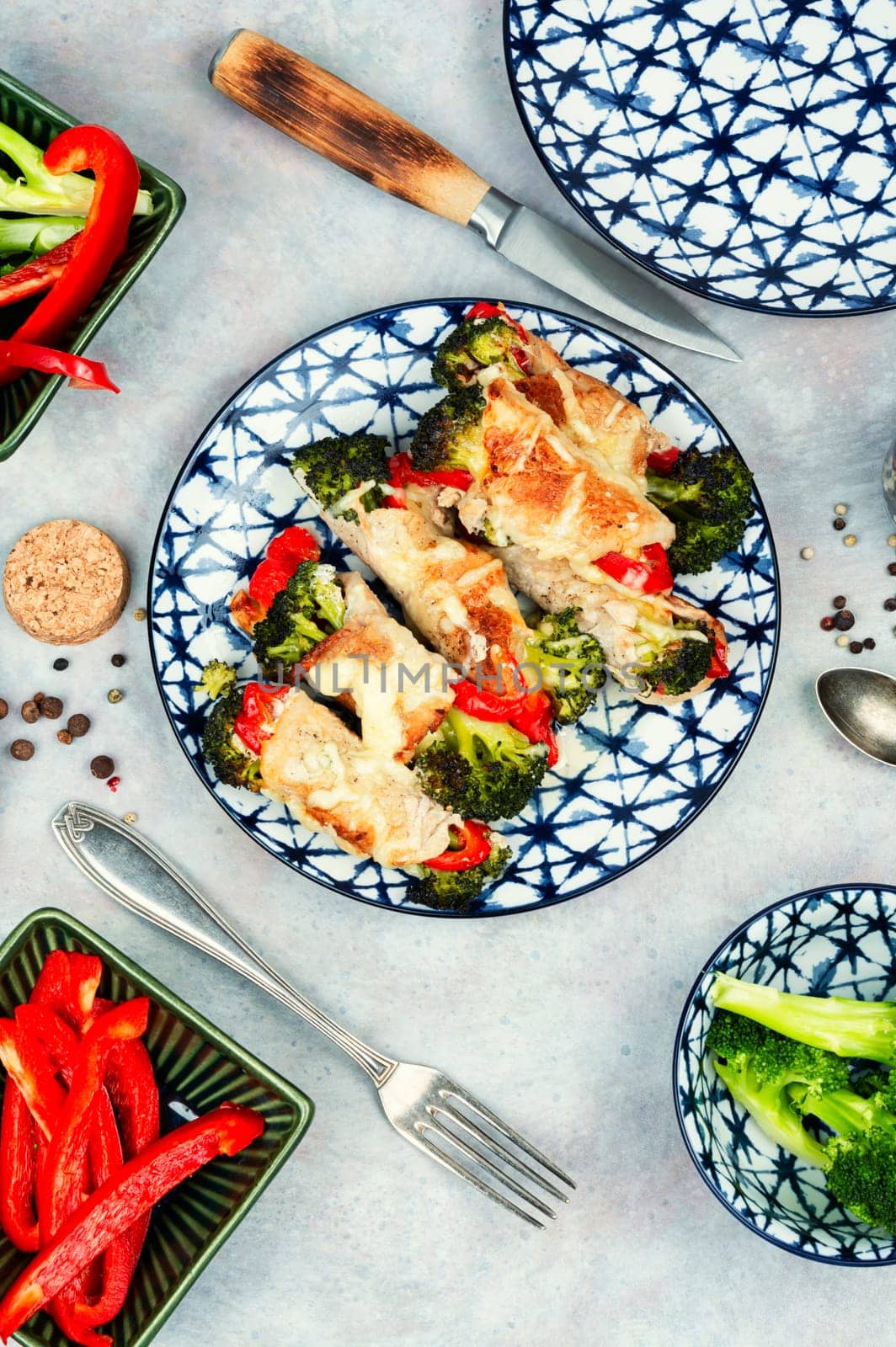 Meat rolls or roulades stuffed with broccoli and peppers. Meat with vegetable filling.