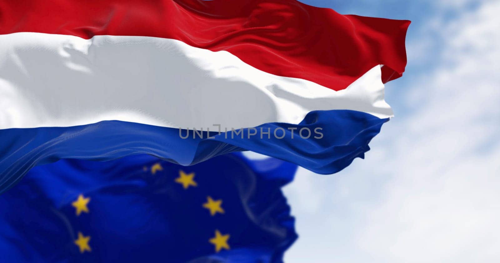 Flags of the Netherlands and the European Union waving in the wind on a clear day. Member of the EU in 1958. 3d illustration render. Fluttering fabric. Selective focus.