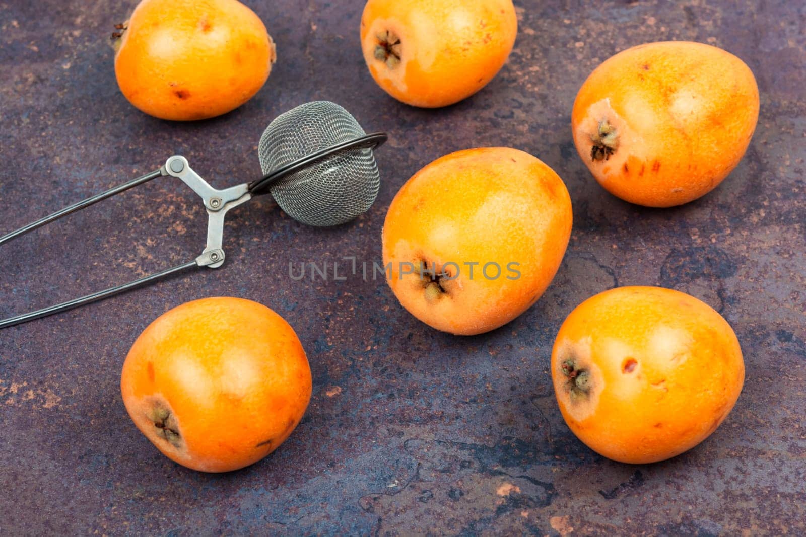 Cooking fresh medlar or loquat nispero fruit sauce. Medlar confiture or jam. Chutney sauce. Top view